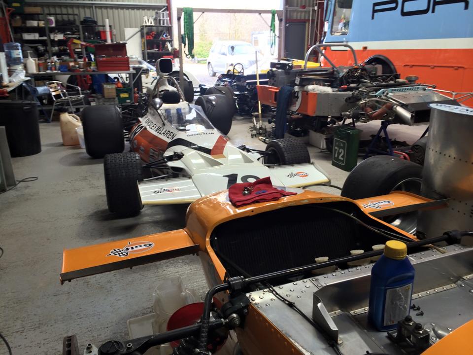 Two Mclaren historic Formula 1 cars, one an M14 and the other an M19.